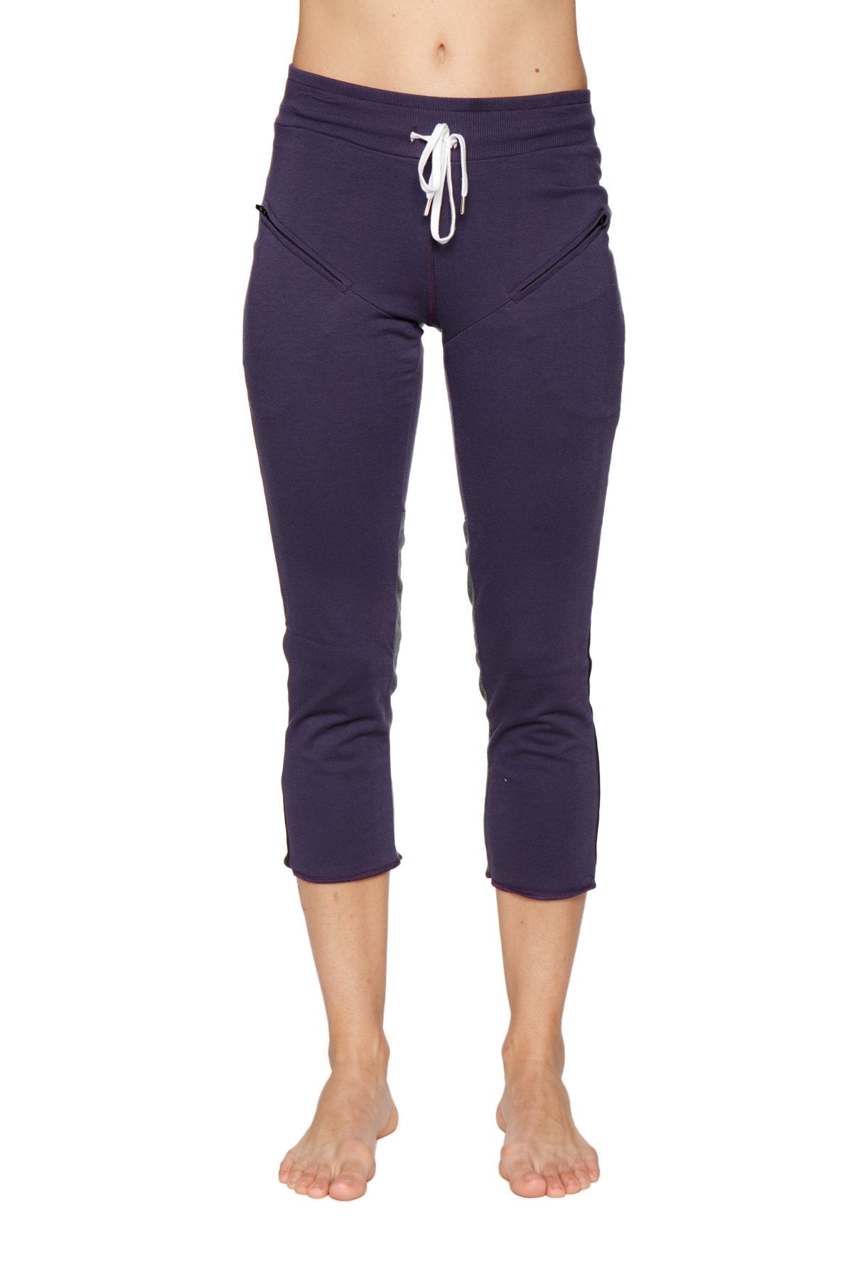 Women’s navy blue capri-length yoga pants with white drawstring waistband and side pockets for activewear