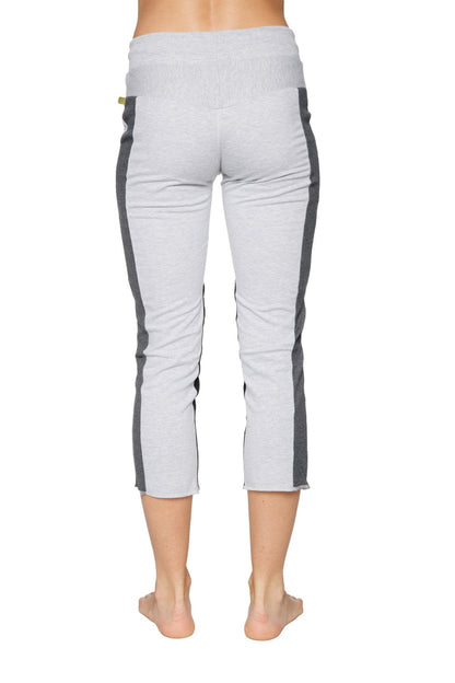 Women’s light gray 4/5 length zipper pocket capri yoga pants with dark gray side panels and green logo waistband