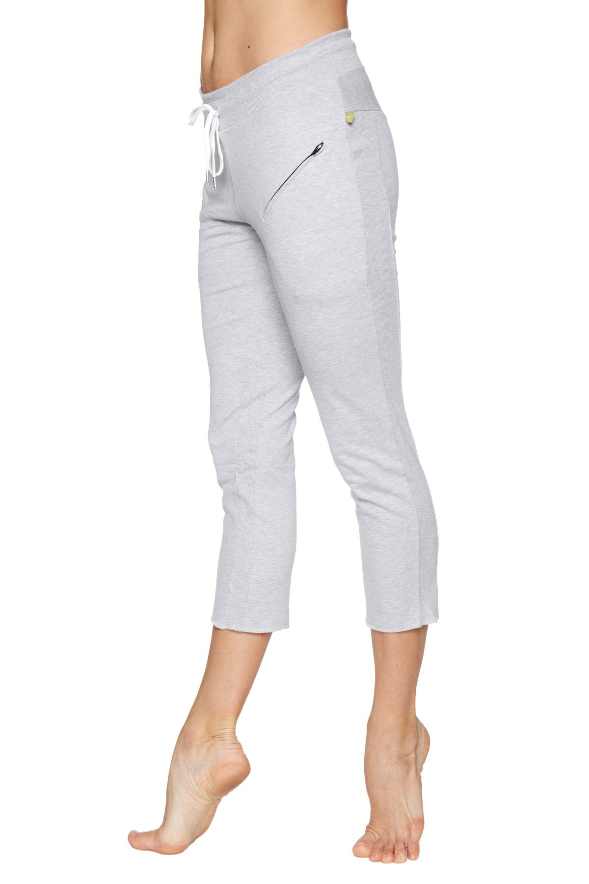 Women’s light gray heather capri yoga pant with drawstring waistband and zippered side pocket for secure storage