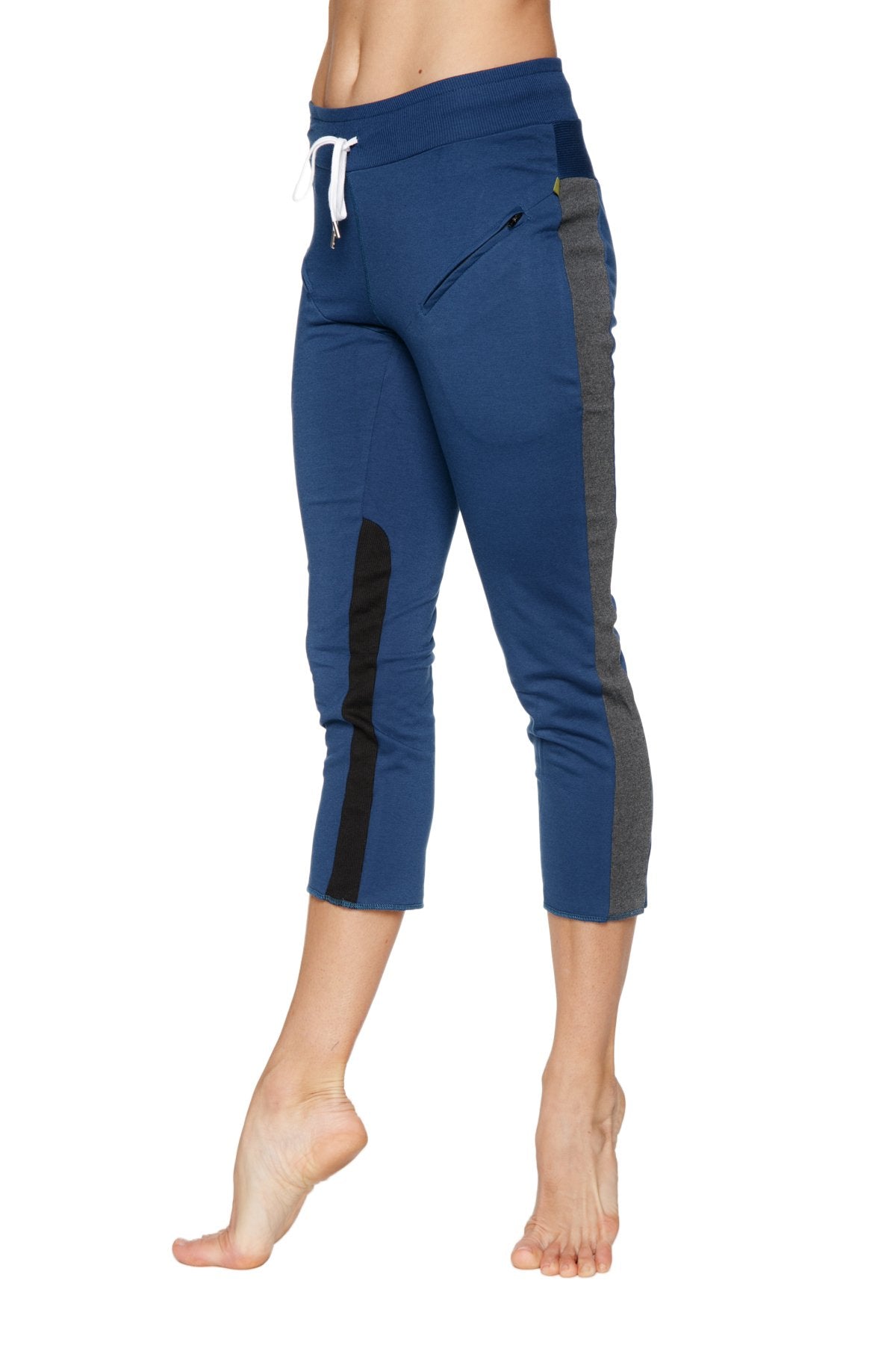 Women’s royal blue 4/5 length capri yoga pant with charcoal and black side panels and zippered thigh pocket