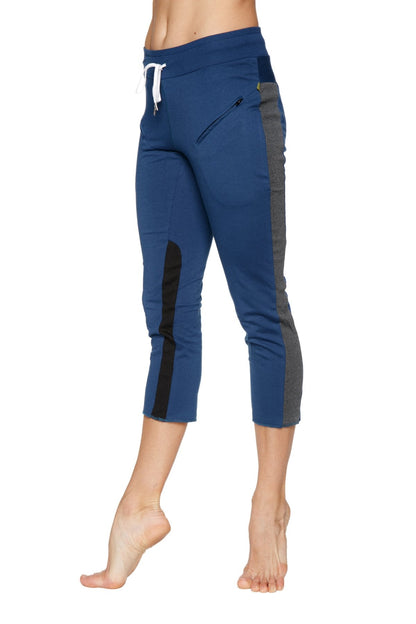 Women’s royal blue 4/5 length capri yoga pant with charcoal and black side panels and zippered thigh pocket
