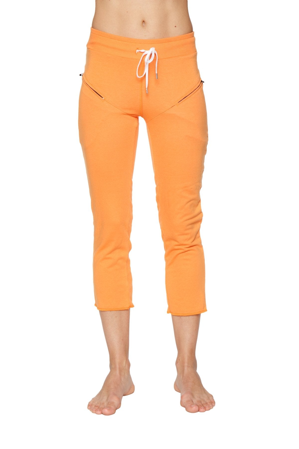 Women’s sun orange 4/5 length zipper pocket capri yoga pants with white drawstring waistband and side pockets