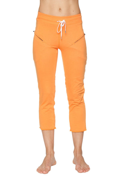Women’s sun orange 4/5 length zipper pocket capri yoga pants with white drawstring waistband and side pockets