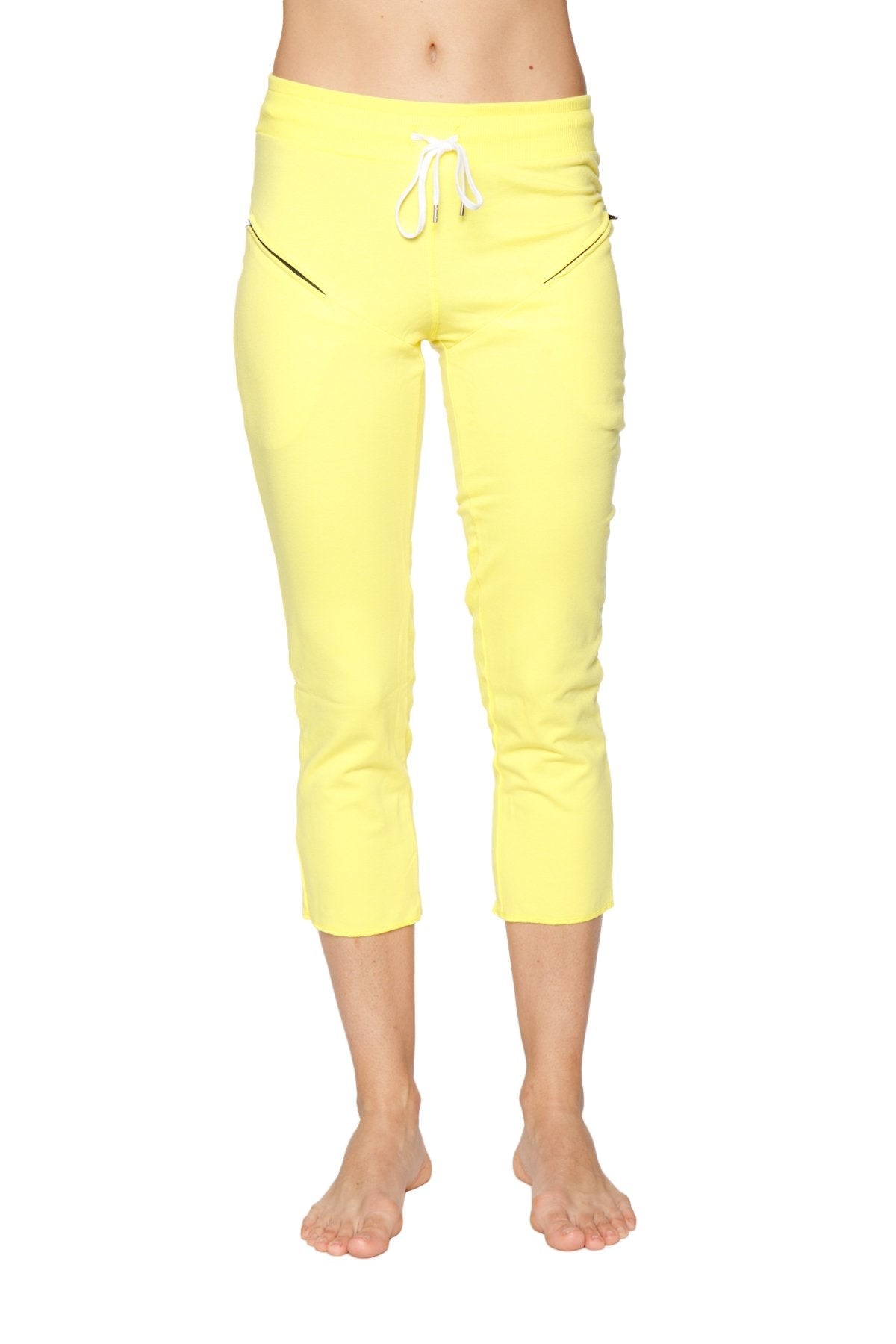 Women’s 4/5 length zipper pocket capri yoga pants in bright yellow with white drawstring waistband and black zipper accents