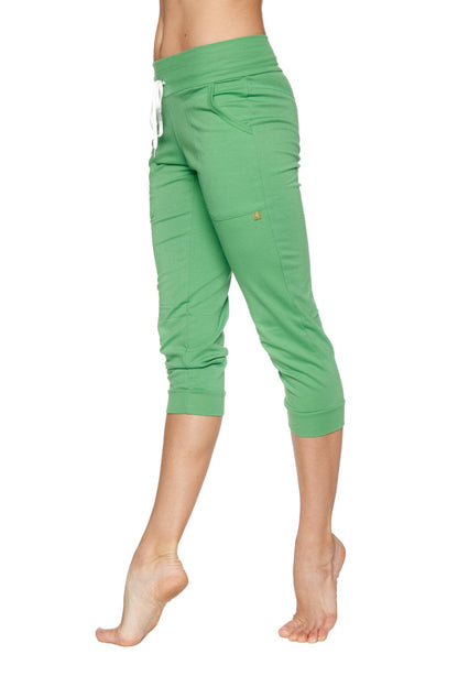 Green cuffed jogger yoga pants with white drawstring waistband and elastic cuffs in bamboo green fabric