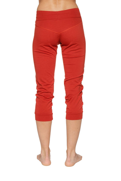 Women’s cinnabar red cuffed jogger yoga pants with stretchy form-fitting fabric and subtle ruching at lower legs