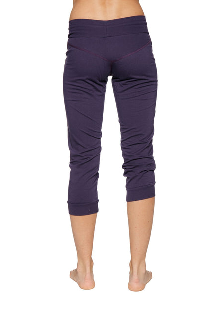 Women’s cuffed jogger yoga pant in navy blue stretchy fabric with high-waisted elastic and rolled cuffs