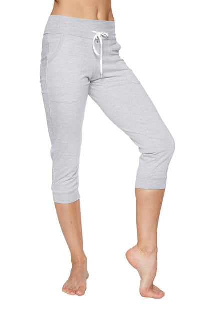 Women’s heather grey cuffed jogger yoga pant with drawstring waistband and side pockets in light gray capri length