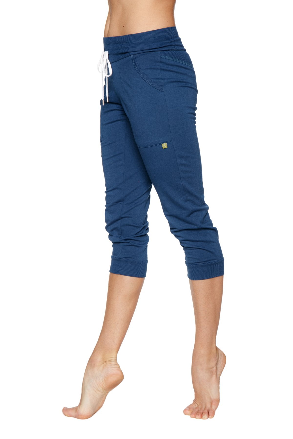 Women’s cuffed jogger yoga pants in solid royal blue navy stretchy fabric with white drawstring waistband and side pockets