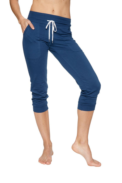 Navy blue cuffed capri joggers with white drawstring waistband and side pockets for yoga and casual wear