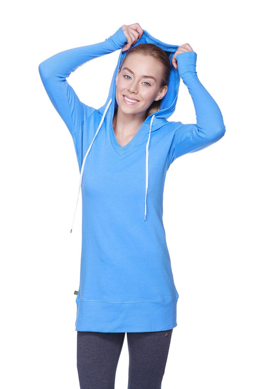 Women’s long body hoodie top in vibrant ice blue with royal blue v-neck and white drawstrings with long sleeves