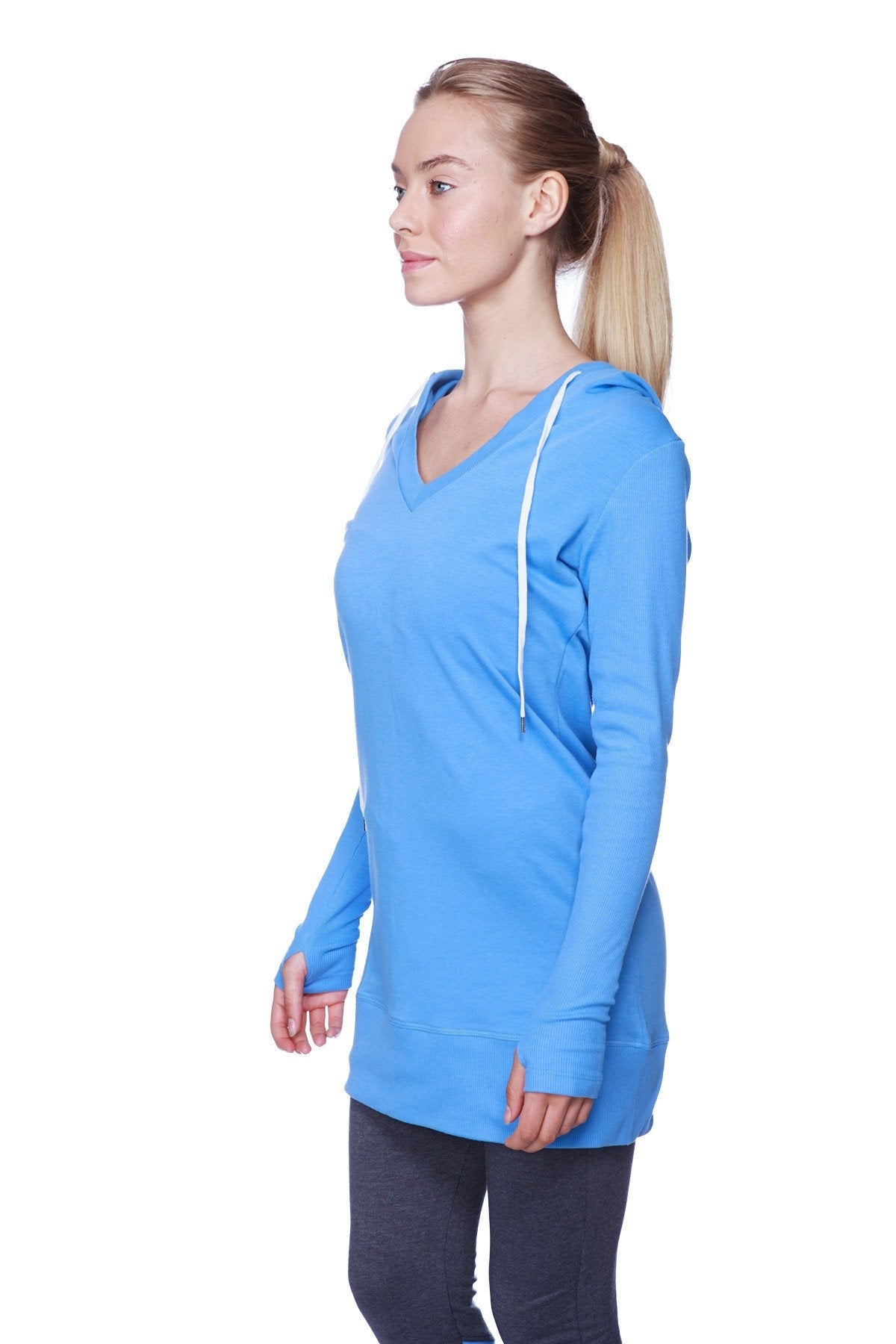 A vibrant ice blue women’s long body hoodie top with royal blue v-neck and white drawstrings in long sleeves