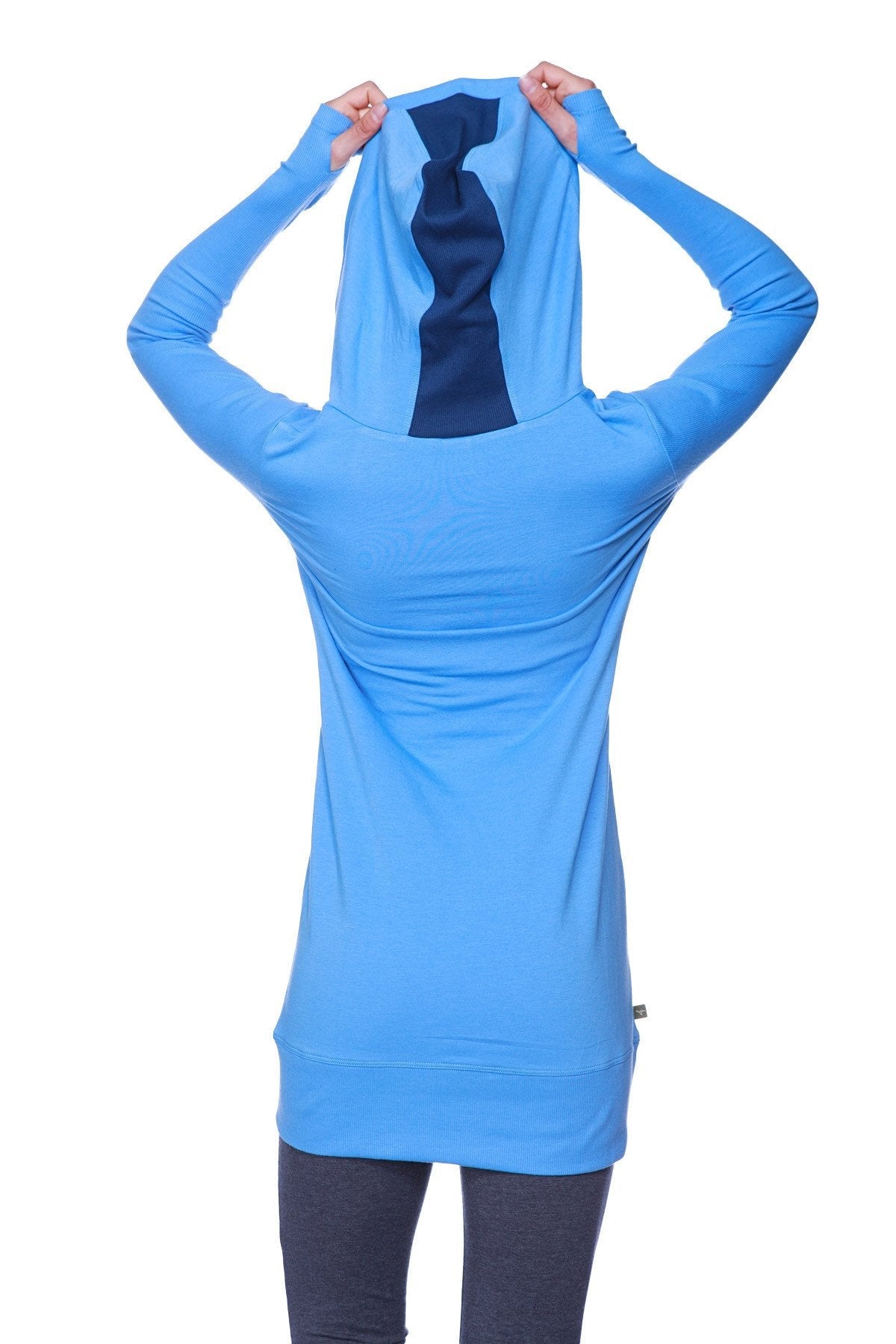 Back view of women’s ice blue long body hoodie top with dark royal blue tie design on the back