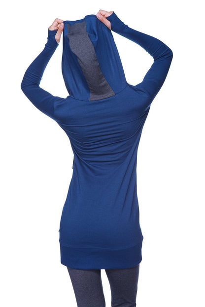 Back view of women’s royal blue long body hoodie top with charcoal gray mesh panel and long sleeves