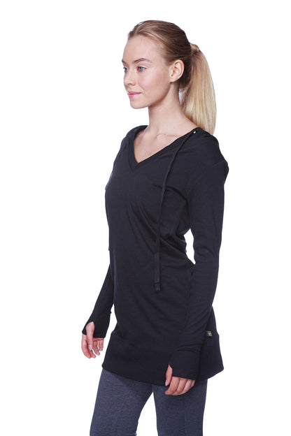 Women’s long body hoodie top in solid black with long sleeves v-neck and drawstring hood for casual wear