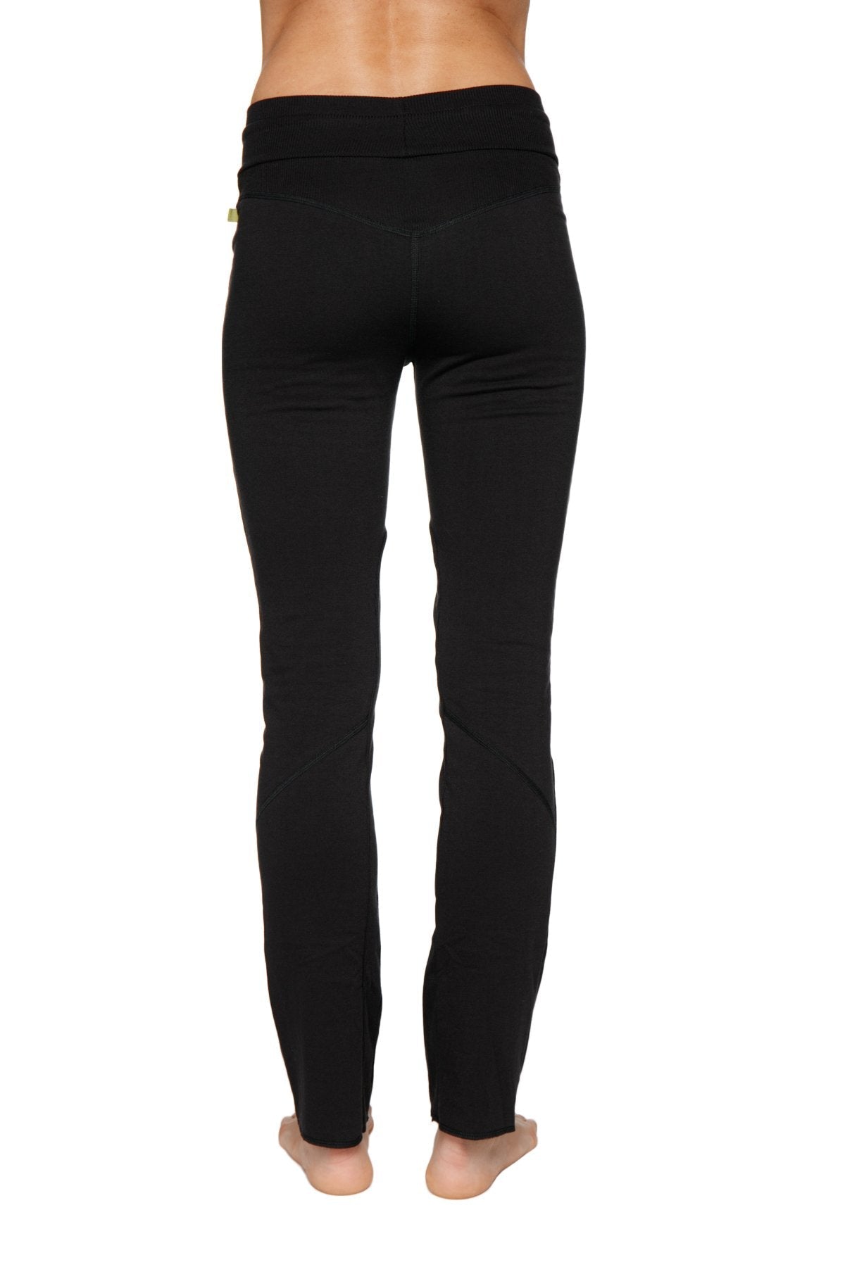Women’s organic boyfriend yoga training pant in black with high-waisted elastic band and subtle seam detailing