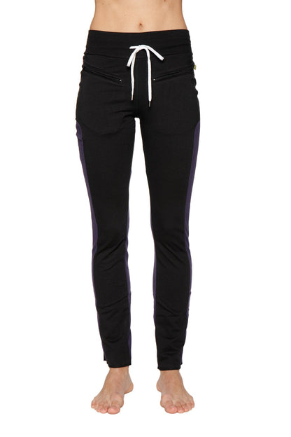 Women’s organic boyfriend yoga training pant in black with purple side panels and white drawstring waistband