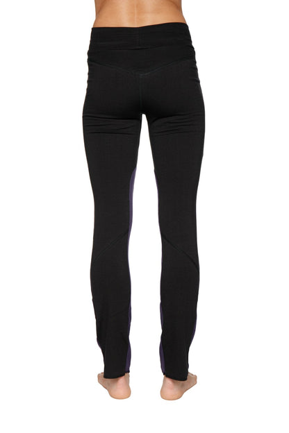 Women’s organic boyfriend yoga training pant in black high-waisted leggings with subtle purple side panels