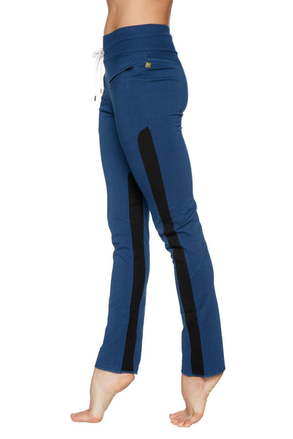 Women’s organic boyfriend yoga training pants in blue with black side stripes and a white drawstring waistband