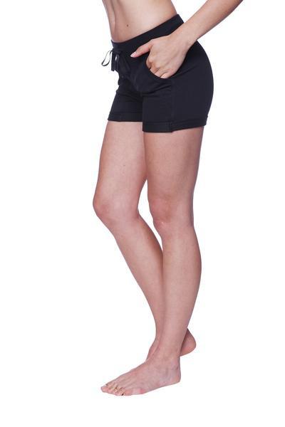 Black women’s performance yoga shorts with a relaxed fit, drawstring waist, and side pockets for comfort and functionality