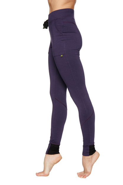Women’s straight-leg long performance yoga pant in purple with black drawstring waistband and ribbed cuffs