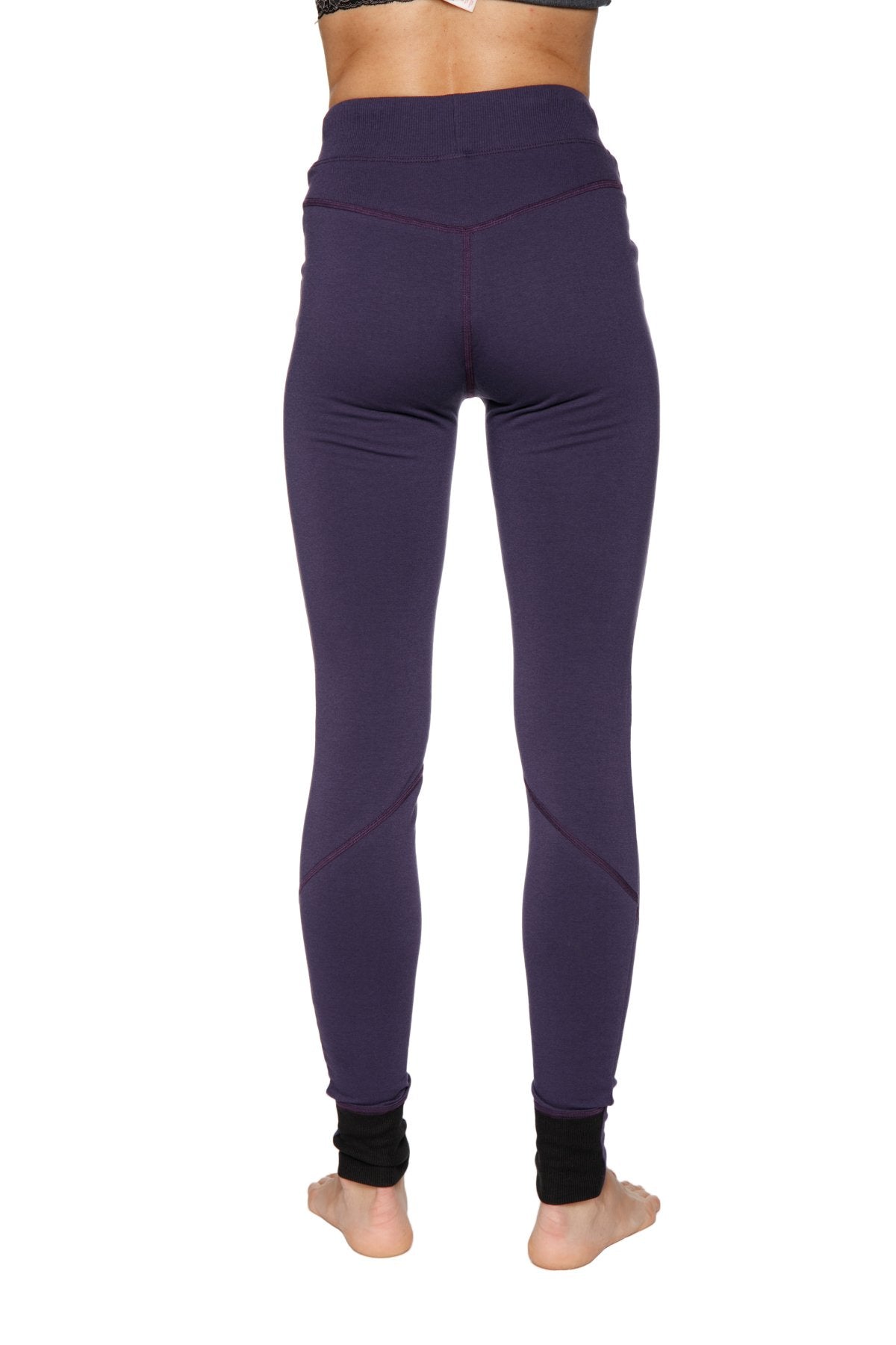 Women’s straight-leg long performance yoga pant in purple with black ribbed cuffs and high-waisted fit