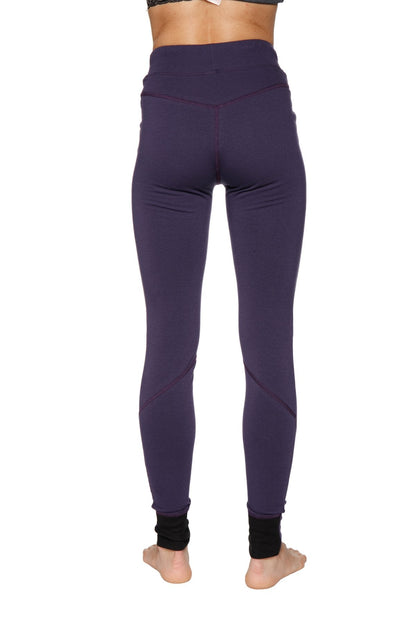 Women’s straight-leg long performance yoga pant in purple with black ribbed cuffs and high-waisted fit