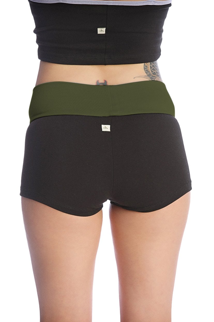 Womens yoga transition short in black with olive green waistband made of soft stretchy fabric with subtle brand tags