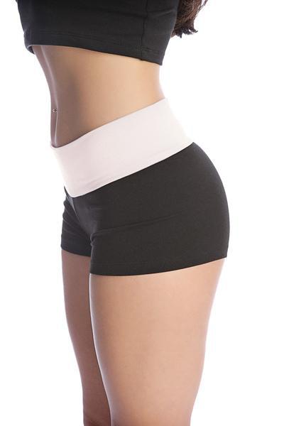Womens yoga transition shorts in black and white with wide contrasting waistband for athletic comfort