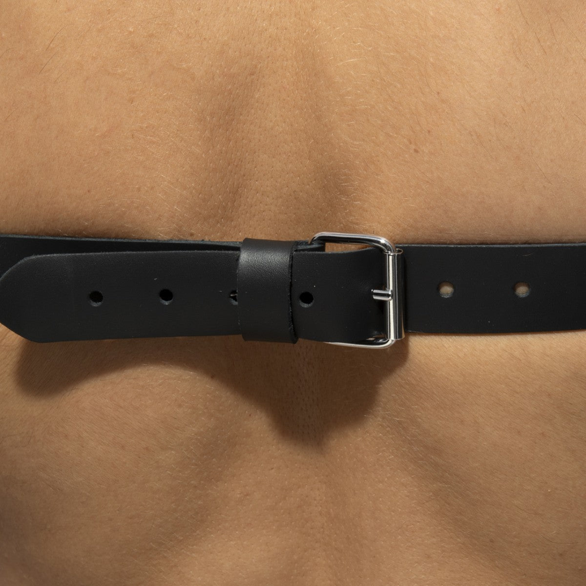 Black leather belt with silver-toned buckle x-cross leather harness featuring durable leather and stylish hardware