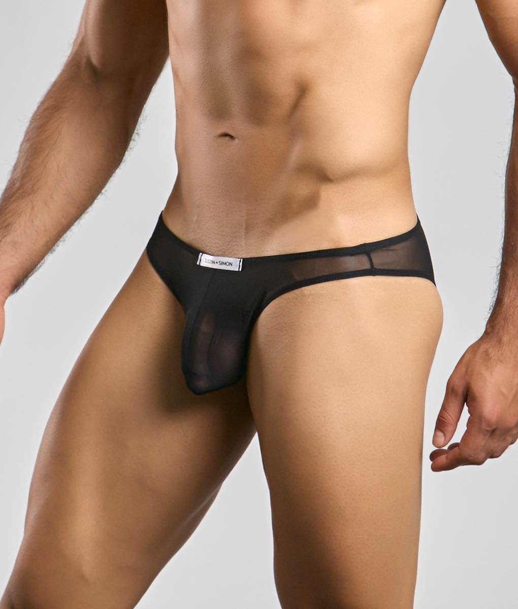 Black sheer mesh thong with solid waistband and white label from justin simon classic mens bikini mesh collection