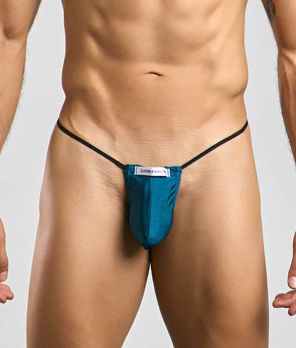 Teal justin simon classic g-string bulge thong with black elastic straps and white brand label, front view