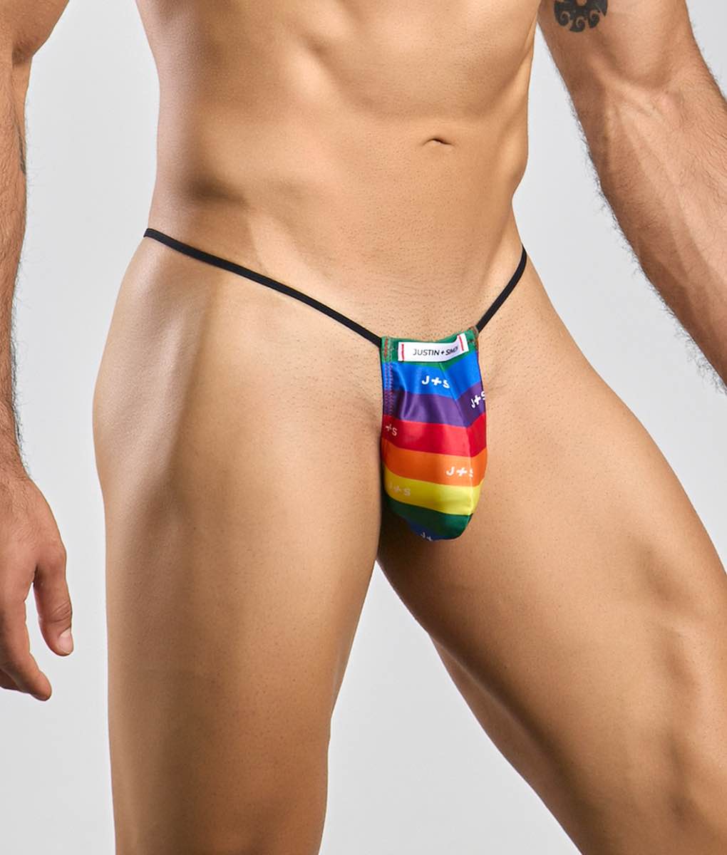 Rainbow-striped fabric thong with black elastic waistband and justin label from the Justin Simon classic G-string bulge collection