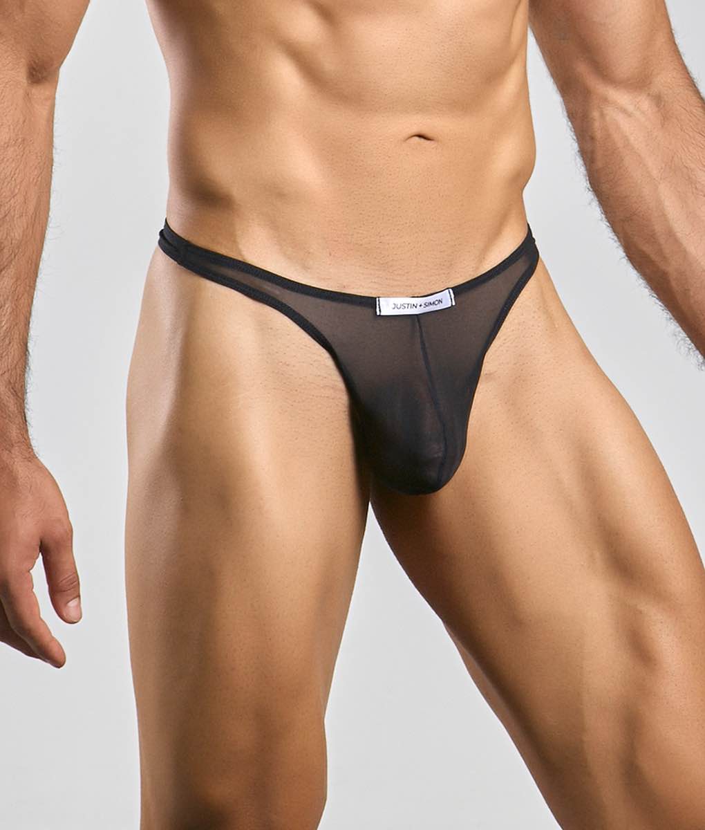 Black sheer mesh thong with white justin and simon label at waistband from justin plus simon classic tanga mesh collection