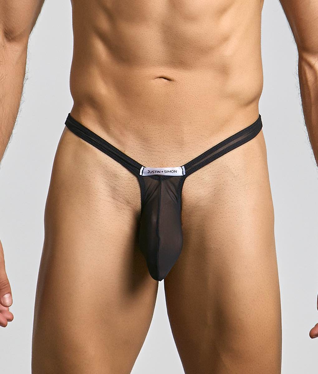 Black sheer mesh bulge thong with silver justin simon label at center designed for stylish comfort