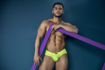 Bright neon yellow xtremen 91227 microfiber briefs with mesh fabric and subtle black logo on the front