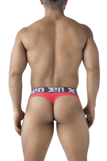 Red men’s microfiber thong in fuchsia with black elastic waistband featuring xen brand logo visible from front