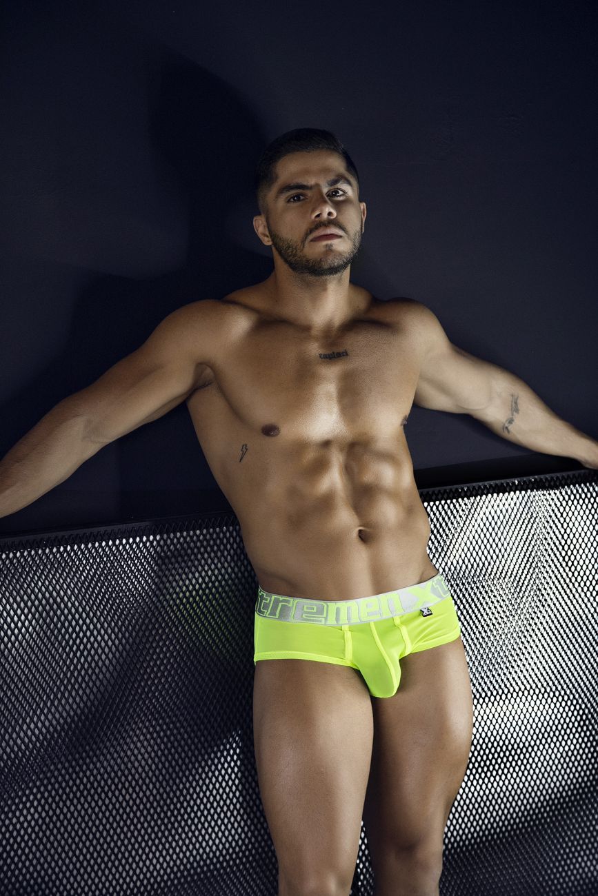 Bright neon yellow microfiber briefs with white elastic waistband and ere branding in black lettering