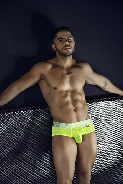 Bright neon yellow microfiber briefs with white elastic waistband and ere branding in black lettering