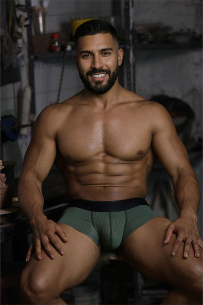 A pair of xtremen 91252 microfiber mesh trunks in military green with textured fabric and a black waistband