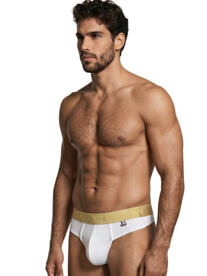 Xtremen white thong featuring a metallic gold logo waistband with a smooth, fitted fabric finish.