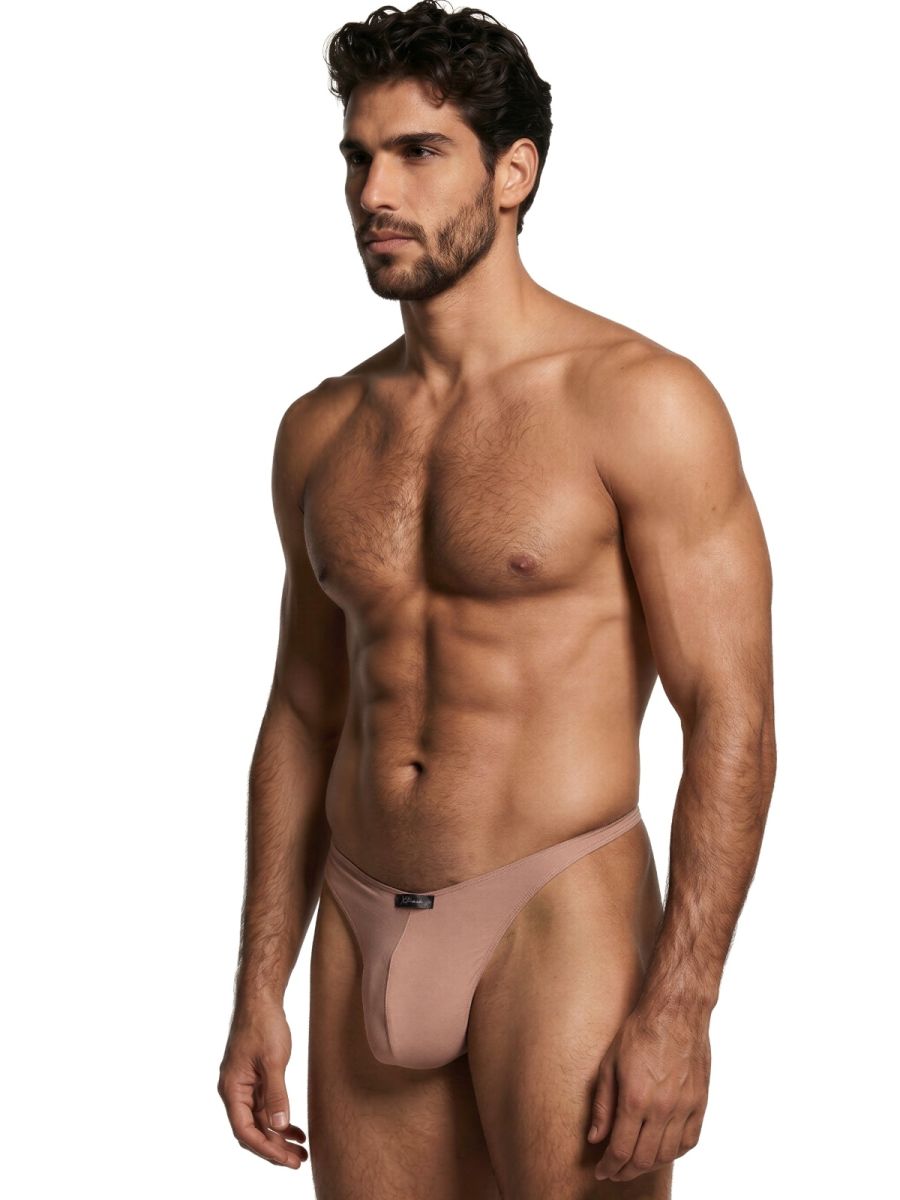 Xtremen tan thong on a fit male model. The fabric has a smooth, soft finish with a small centered brand logo.