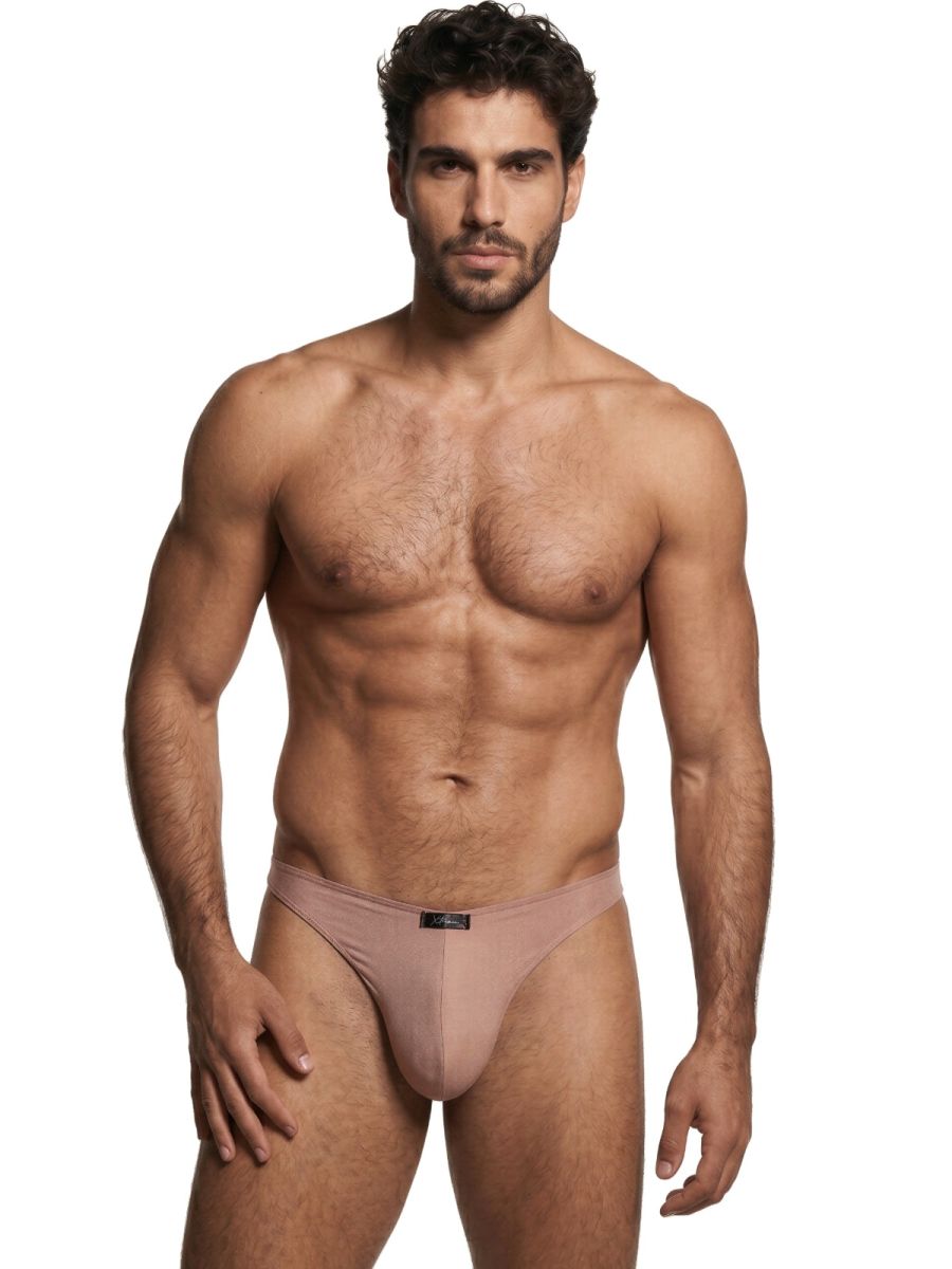Xtremen beige bikini brief with a matte finish worn by a fit model on a white background.