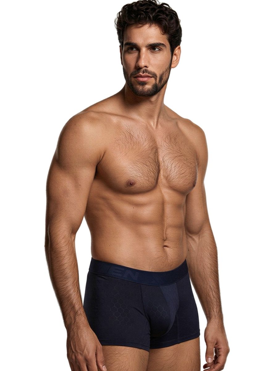 Xtremen navy boxer brief with a textured honeycomb pattern and logo waistband worn by a shirtless man.