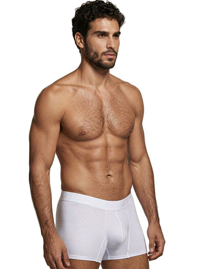 Model wearing white Xtremen boxer briefs with a subtle geometric pattern and form-fitting silhouette.