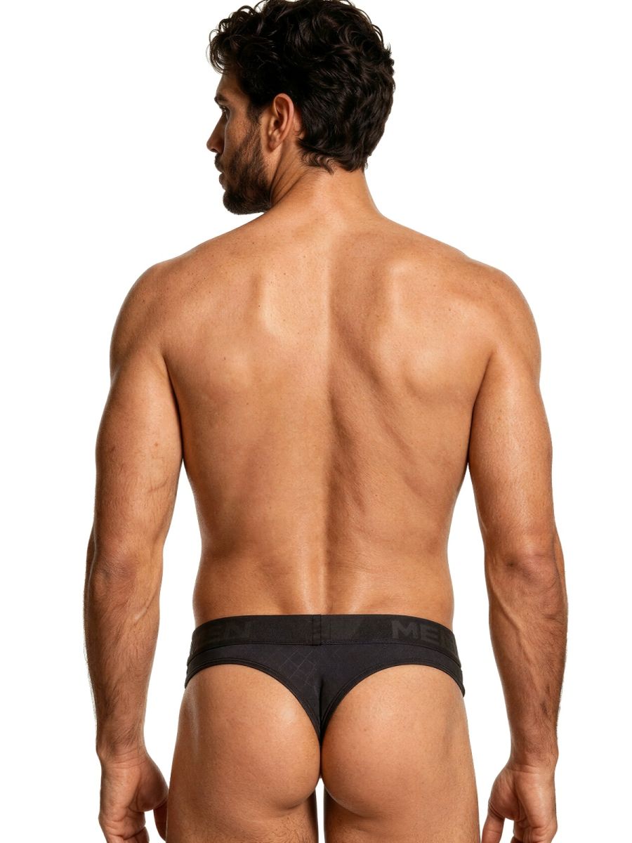 Xtremen black thong for men with a branded elastic waistband, featuring a fitted, textured fabric design.