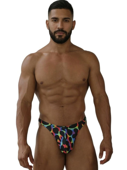 Men’s xtremen 91284 printed microfiber thong in colorful leopard print on black fabric with vibrant mushroom tones