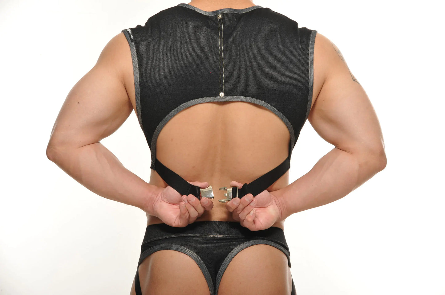 Black mesh backless Yannick muscle top with gray trim and adjustable straps for athletic use shown from back side