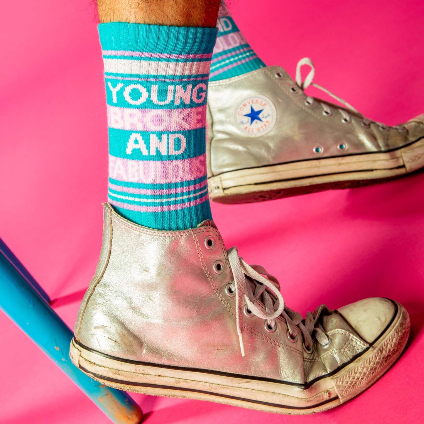 Silver high-top converse all stars with white laces and faded sole paired with young broke and fabulous crew socks