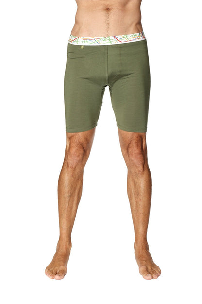 Olive green yoga compression shorts with white waistband and colorful abstract patterns for active wear